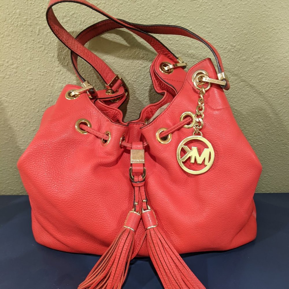 Michael Kors Slouchy Pebbled Leather Shoulder Bag in Orange. (11 x 14") Used.